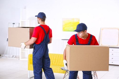 Removal van and moving team in a Greenwich residential street