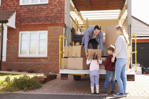 Professional movers handling furniture transport for a Greenwich home