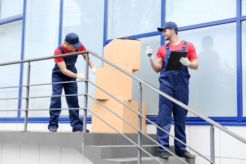 Greenwich man and van service loading moving boxes