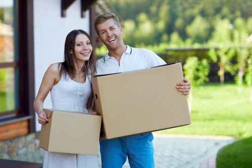 Loading furniture and boxes into a van for a Greenwich home move