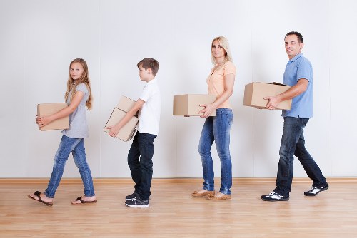 Greenwich business premises relocation with labelled boxes and office desks