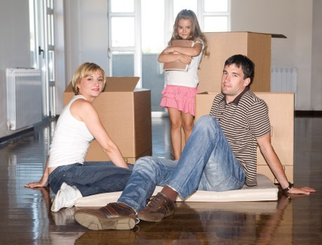 Moving van near Greenwich with local streets and residential buildings